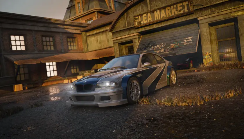 BMW M3 E46 z kultowej gry Need for Speed Most Wanted Remake czeka na wyścig przy zniszczonym "Flea Market".