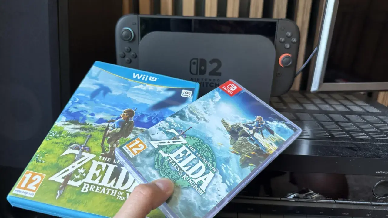 Dwie gry z serii Zelda: Breath of the Wild i Tears of the Kingdom, obok konsoli Nintendo Switch.
